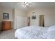 This bedroom has carpeted floors, neutral colored walls, ceiling fan and an ensuite bathroom at 2875 W Highland St # 1152, Chandler, AZ 85224