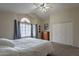 This primary bedroom boasts carpeted floors, ceiling fan and multiple windows for natural light at 2875 W Highland St # 1152, Chandler, AZ 85224