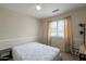 Neutral bedroom featuring a ceiling fan, window and neutral carpeting at 2875 W Highland St # 1152, Chandler, AZ 85224