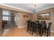 The dining room has laminate flooring, a blue chandelier and is open to other rooms at 2875 W Highland St # 1152, Chandler, AZ 85224
