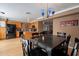 This dining area offers light wood floors and black appliances in the kitchen at 2875 W Highland St # 1152, Chandler, AZ 85224