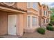 Charming townhome showcasing a stucco exterior, well-manicured landscaping, and decorative window accents at 2875 W Highland St # 1152, Chandler, AZ 85224