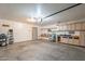 Spacious garage with built in cabinets and shelving offers ample storage space for organization and projects at 2875 W Highland St # 1152, Chandler, AZ 85224