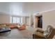Inviting living room featuring neutral paint, plush carpeting, and a comfortable leather sofa at 2875 W Highland St # 1152, Chandler, AZ 85224