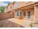 This patio has stone tiling, a brick fence, a door and big window into the house, and great sunlight at 2875 W Highland St # 1152, Chandler, AZ 85224