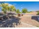 Large backyard featuring gravel landscaping and a wrought iron fence at 3028 W T Ryan Ln, Phoenix, AZ 85041