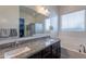 This bathroom features double sinks, granite counters, and a separate tub and shower at 3028 W T Ryan Ln, Phoenix, AZ 85041