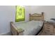 This bedroom features a bed with unique decor and a matching nightstand at 3028 W T Ryan Ln, Phoenix, AZ 85041