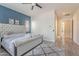 Comfortable primary bedroom has hardwood floors, neutral colors, and backyard views at 3028 W T Ryan Ln, Phoenix, AZ 85041