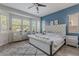 Primary bedroom with accent wall, natural light, plush carpet and a luxury upholstered bed at 3028 W T Ryan Ln, Phoenix, AZ 85041
