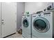 This laundry room includes a modern, front-load washer and dryer set at 3028 W T Ryan Ln, Phoenix, AZ 85041