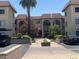 Exterior view of condo complex featuring manicured landscaping and covered parking at 3033 E Devonshire Ave # 3003, Phoenix, AZ 85016