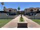Exterior view of condo complex with manicured landscaping and covered parking at 3033 E Devonshire Ave # 3003, Phoenix, AZ 85016