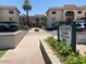 Olive Grove Village Condominiums featuring manicured landscaping, covered parking, and signage at 3033 E Devonshire Ave # 3003, Phoenix, AZ 85016