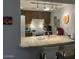 Bright kitchen featuring a breakfast bar and modern appliances at 3033 E Devonshire Ave # 3003, Phoenix, AZ 85016