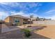 Enjoy the spacious backyard, perfect for outdoor gatherings, featuring a patio and basketball court at 30993 W Indianola Ave, Buckeye, AZ 85396