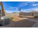 Backyard with a basketball court offers endless opportunities for outdoor activities and recreation at 30993 W Indianola Ave, Buckeye, AZ 85396