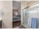En suite bathroom with glass enclosed shower and entrance to main bedroom at 30993 W Indianola Ave, Buckeye, AZ 85396