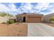 Charming single-story home with a neutral color palette, desert landscaping, and a two-car garage at 30993 W Indianola Ave, Buckeye, AZ 85396