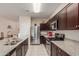 Beautiful kitchen featuring stainless steel appliances and granite countertops for a modern look and feel at 30993 W Indianola Ave, Buckeye, AZ 85396