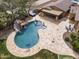 Wonderful aerial view of an outdoor living space featuring a beautiful pool, spa, and BBQ island perfect for entertaining at 3381 E Azalea Dr, Chandler, AZ 85286