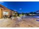 Expansive backyard with travertine tile, pool, fire pit, and outdoor seating perfect for entertaining at 3381 E Azalea Dr, Chandler, AZ 85286