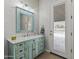 Charming bathroom with custom vanity, decorative mirror, and convenient access to outdoor pool at 3381 E Azalea Dr, Chandler, AZ 85286