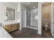 Bright bathroom featuring a large shower, wood cabinets, and a large illuminated mirror at 3381 E Azalea Dr, Chandler, AZ 85286
