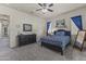 Comfortable carpeted bedroom with ceiling fan, dresser and black trim at 3381 E Azalea Dr, Chandler, AZ 85286