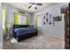 Bright bedroom featuring neutral paint, carpet, blue patterned bed, and pops of lime-green accents at 3381 E Azalea Dr, Chandler, AZ 85286