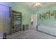 This is a bedroom with vines, a bookshelf, neutral carpet, and a twin bed with a grey comforter at 3381 E Azalea Dr, Chandler, AZ 85286