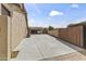 A spacious driveway leads to an open three-car garage with ample parking with a lush yard in the background at 3381 E Azalea Dr, Chandler, AZ 85286