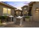Inviting front entrance featuring stone accents, pavers, and a charming gated courtyard at 3381 E Azalea Dr, Chandler, AZ 85286