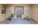 Welcoming front porch decorated with plants, a wreath, and a 'Home Sweet Home' mat at 3381 E Azalea Dr, Chandler, AZ 85286