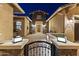 Charming front entrance features stone accents, a welcoming courtyard, and a decorative gate at 3381 E Azalea Dr, Chandler, AZ 85286