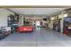 Spacious three-car garage with ample storage and a vintage Corvette at 3381 E Azalea Dr, Chandler, AZ 85286