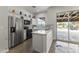 Modern kitchen with stainless steel appliances, white countertops, and views of the outdoor pool at 3381 E Azalea Dr, Chandler, AZ 85286