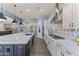 Spacious kitchen with a large island, modern backsplash, stainless steel appliances, and ample cabinet space at 3381 E Azalea Dr, Chandler, AZ 85286