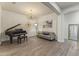 Elegant living room featuring a piano and hardwood floors that create a welcoming atmosphere at 3381 E Azalea Dr, Chandler, AZ 85286