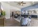 Open-concept living space with a large blue sectional, views into the kitchen, and modern finishes at 3381 E Azalea Dr, Chandler, AZ 85286