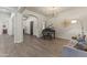 Elegant living room featuring a piano and hardwood floors that create a welcoming atmosphere at 3381 E Azalea Dr, Chandler, AZ 85286