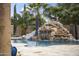 Beautiful stone waterfall feature in the backyard pool area, surrounded by palm trees and lush landscaping at 3381 E Azalea Dr, Chandler, AZ 85286
