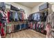 Large walk-in closet featuring ample storage with shelves and hanging rods for organization at 3381 E Azalea Dr, Chandler, AZ 85286
