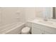 Clean bathroom featuring a combination shower and tub and modern vanity with countertop space at 37458 W San Clemente St, Maricopa, AZ 85138