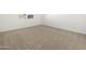 Bright bedroom featuring neutral carpet and a window with blinds at 37458 W San Clemente St, Maricopa, AZ 85138