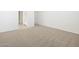 Spacious bedroom with neutral carpet near bathroom at 37458 W San Clemente St, Maricopa, AZ 85138