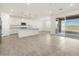 Spacious kitchen with granite counters, stainless appliances, and access to the backyard patio at 37458 W San Clemente St, Maricopa, AZ 85138