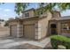 Two-story stucco home featuring a tile roof, 3-car garage, and gated front porch at 3795 W Mercury Way, Chandler, AZ 85226