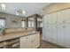 Open kitchen featuring white cabinets, tile backsplash, stainless steel appliances, and eat-in nook at 3795 W Mercury Way, Chandler, AZ 85226