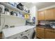 Spacious laundry room with washer, dryer, storage cabinets and shelving at 3795 W Mercury Way, Chandler, AZ 85226